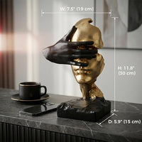 Close view of the artistic facial details and thoughtful hand gesture on the resin sculpture
