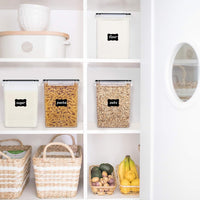 Plastic canisters storing rice, cereal, and baking supplies