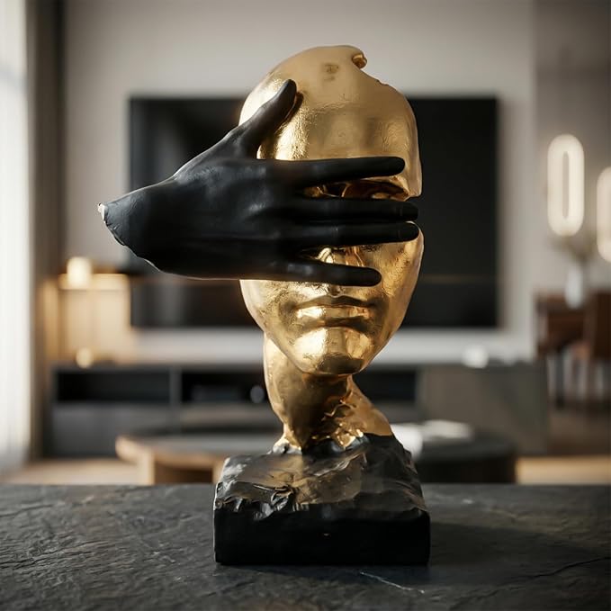 Resin thinker figurine positioned on a clean office desk beside minimal accessories