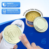 Black automatic electric can opener placed on a kitchen worktop beside canned ingredients.