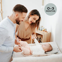 Newborn Sleeping Comfortably on Organic Infant Cushion