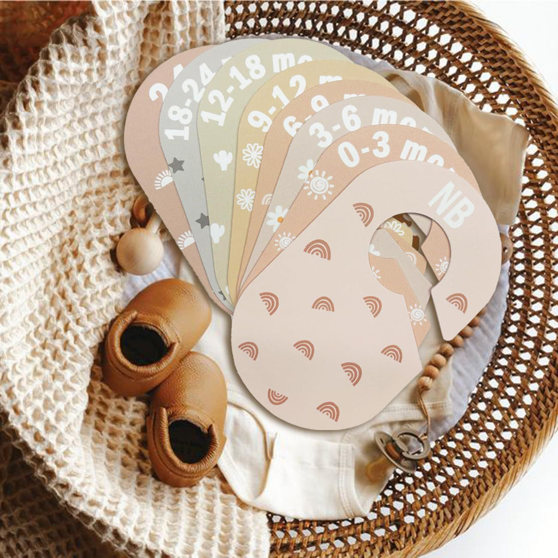 Baby wardrobe organizer with clothes hanger dividers, sorting 8 sizes from Newborn to Toddler.