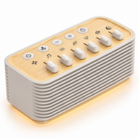 Tabletop baby white noise machine with adjustable sound controls and wood-look top panel
