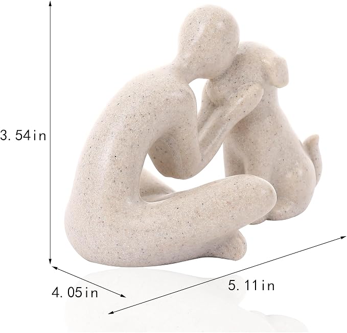 Compact human and canine figurine displayed on a bedroom side cabinet