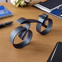 Abstract cycle silhouette ornament featuring an open linear structure