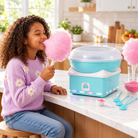 Blue candy floss machine arranged on a colourful birthday party dessert table.