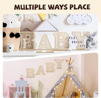 Boho nursery decor with wooden letters, adding a rustic, personalized touch to your baby’s room.