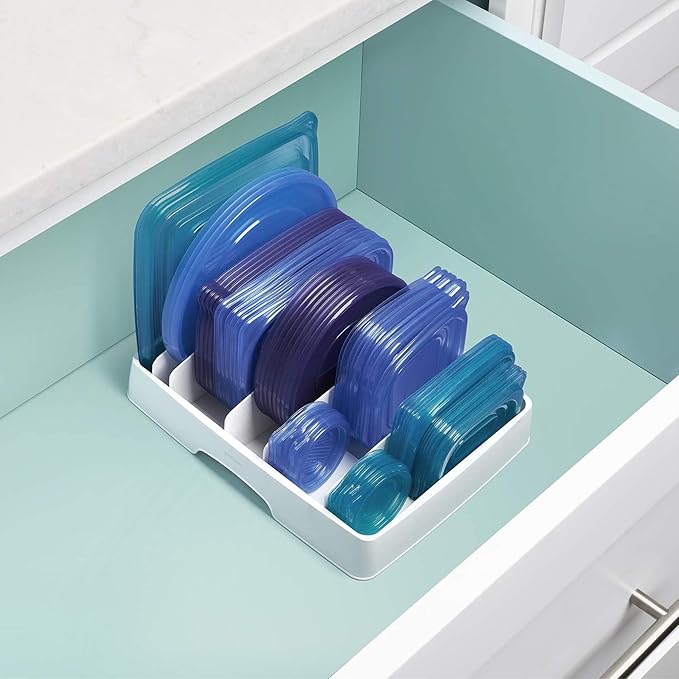 Cabinet lid holder designed for container lids and small kitchen storage items.