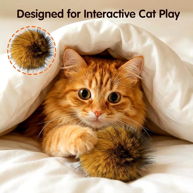 Indoor cat playing with a soft fur ball