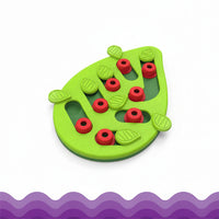 Indoor cat using interactive puzzle feeder with 16 treat compartments