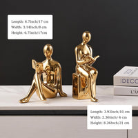 Decorative ceramic book holders arranged on a home office desk