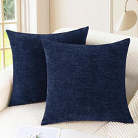 Navy blue chenille pillow covers on modern sofa