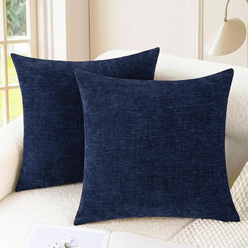 Navy blue chenille pillow covers on modern sofa