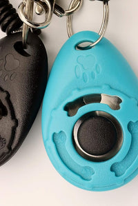 Clear and distinct sound pet training clicker for effective dog training.