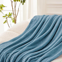 Decorative waffle fleece blanket on lounge chair