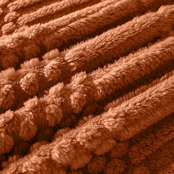 Stylish rust colored blanket for cozy home interior