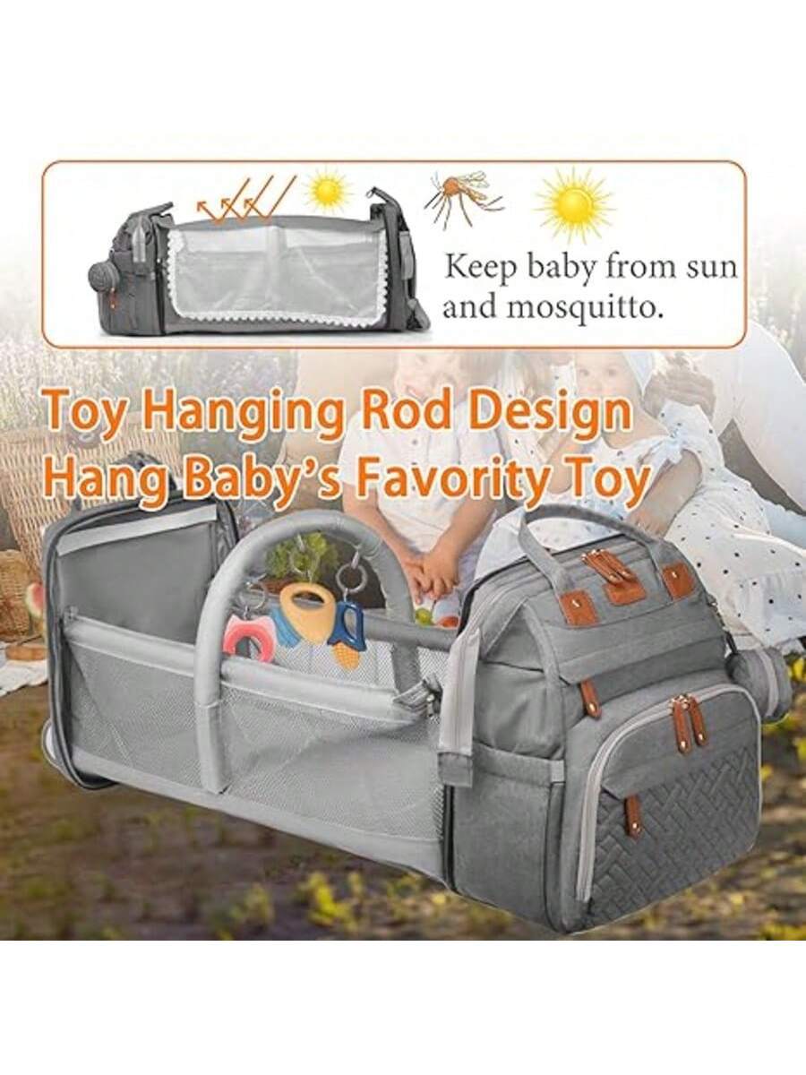 Diaper bag backpack with changing pad, perfect for organized outings with your baby.