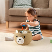 Diaper caddy basket made from cotton rope, great for organizing diapers and baby clothes.