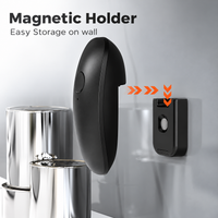 Automatic electric tin opener placed on a food can during the opening process.