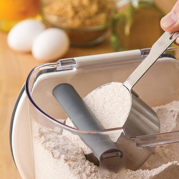 Clear flour storage container with fitted lid for organized kitchen pantry use.