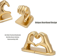 Close-up view of the gold-tone hand sculpture book stopper