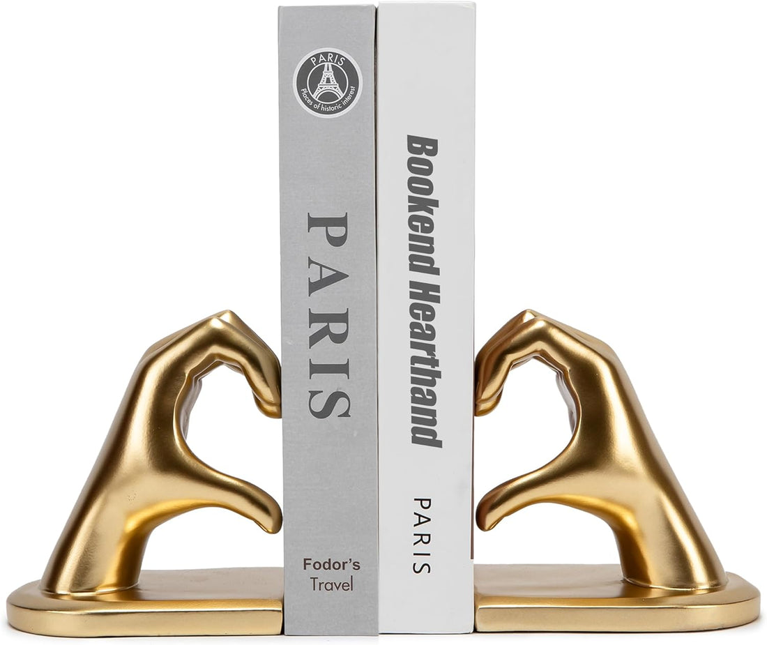 Pair of gold hand sculpture decorative bookends shown from the front