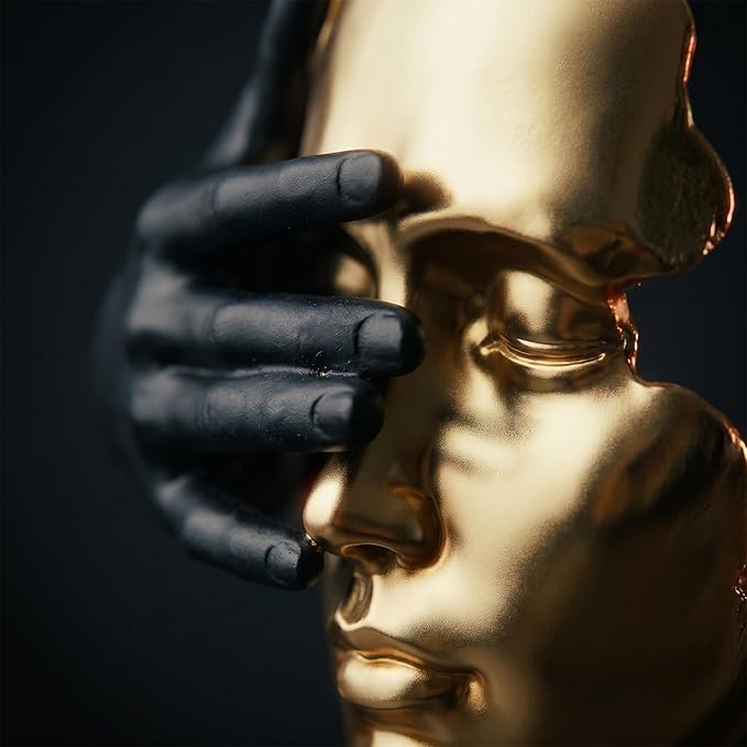 Decorative gold statue displayed as a focal accent on a modern tabletop