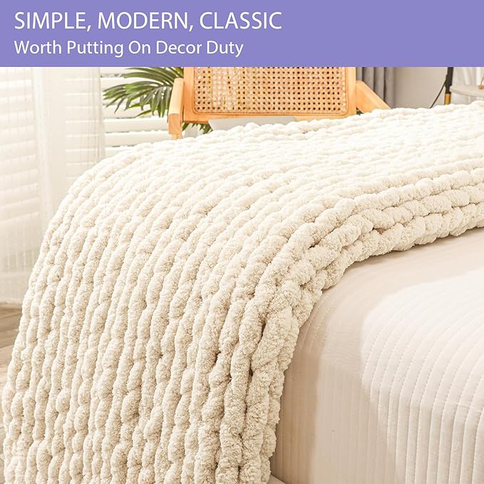 Thick hand knitted jumbo yarn throw blanket on bed
