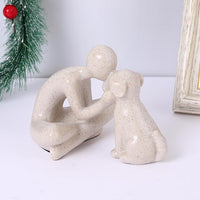 Side view highlighting the sculpted pose between a person and companion animal