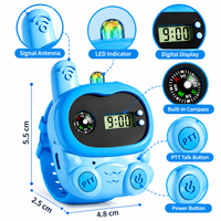 Close-up of a blue children's walkie talkie watch featuring PTT talk and power buttons.