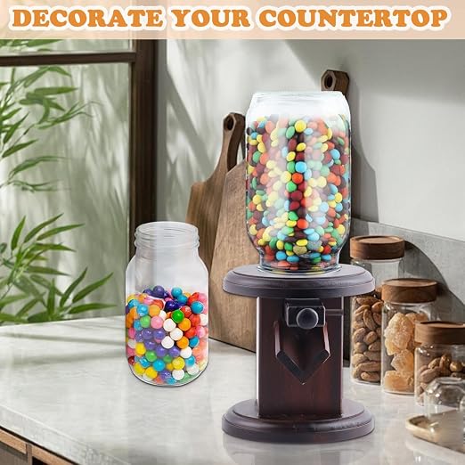 Wooden candy serving accessory placed on a modern kitchen worktop beside assorted treats.