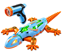 White and orange robotic lizard toy with illuminated green panels and wireless remote control.