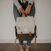 Large diaper backpack with stroller straps, ideal for hands-free convenience.