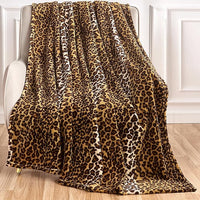 Soft dark brown cheetah print blanket on sofa