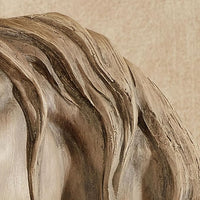Freestanding horse figurine displayed on a contemporary living room console
