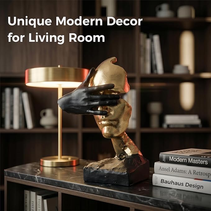 Side profile of the metallic gold figurine showing its sculpted facial shape and smooth finish