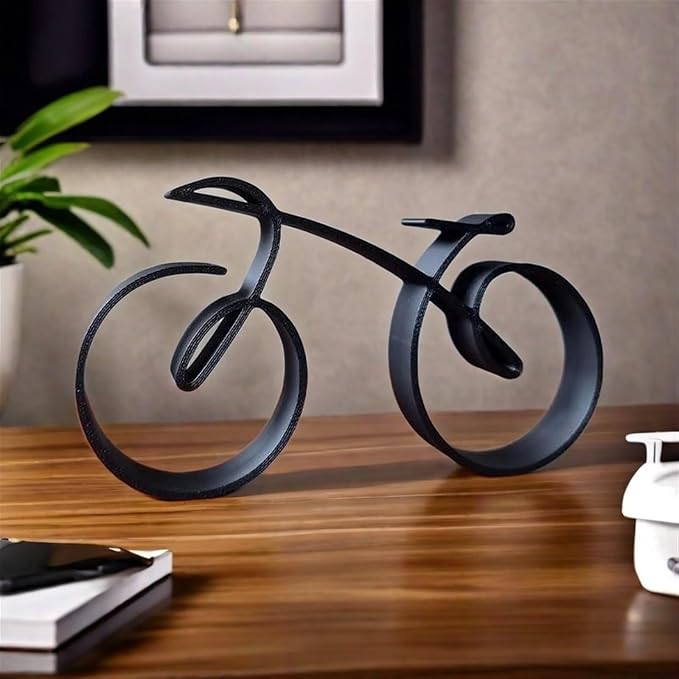 Minimalist wire-frame bicycle sculpture displayed upright on a plain surface