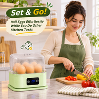 Compact electric food steamer used to prepare fresh vegetables in a home kitchen.
