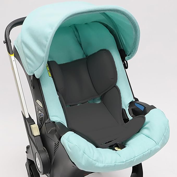 Newborn car seat insert offering plush support for infants, suitable for various car seat models like Doona and Graco.
