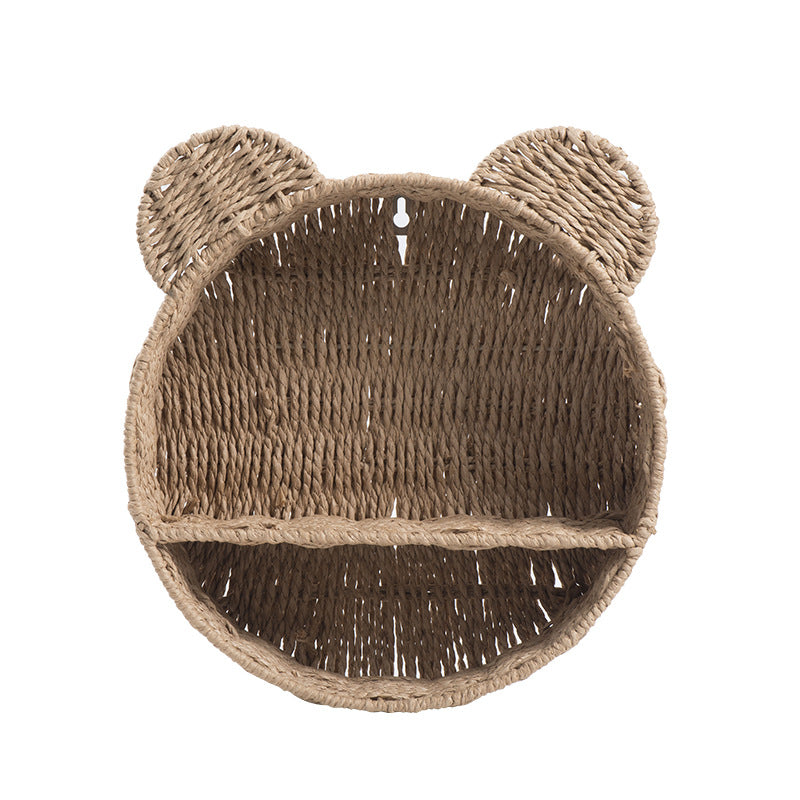 Nursery decor wall shelf made of handwoven wicker, perfect for baby room storage.