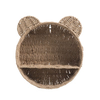 Nursery decor wall shelf made of handwoven wicker, perfect for baby room storage.