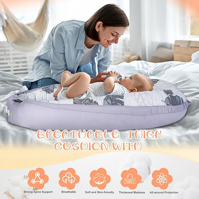 Newborn Resting Comfortably in Organic Cotton Baby Lounger