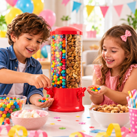 Red triple candy machine arranged on a birthday party table with colourful sweets.
