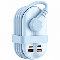 Purple desktop charging accessory displayed beside compatible electronics.