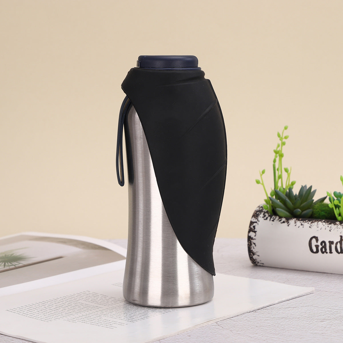 Portable pet water bottle with handle for easy carrying during walks