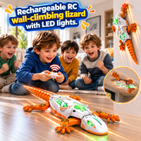 White and orange rechargeable robotic gecko toy featuring bright green illuminated details.