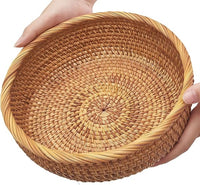 Round natural rattan wicker bread basket shown from the front