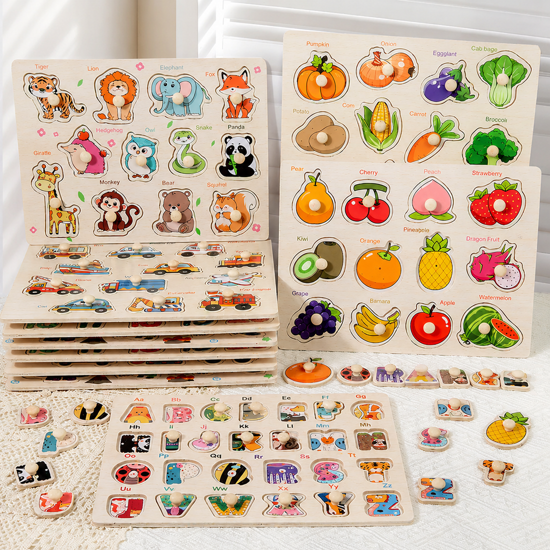 A colorful children's educational puzzle toy set featuring animal and fruit/vegetable cutout boards with labeled pieces, arranged on a white textured surface.