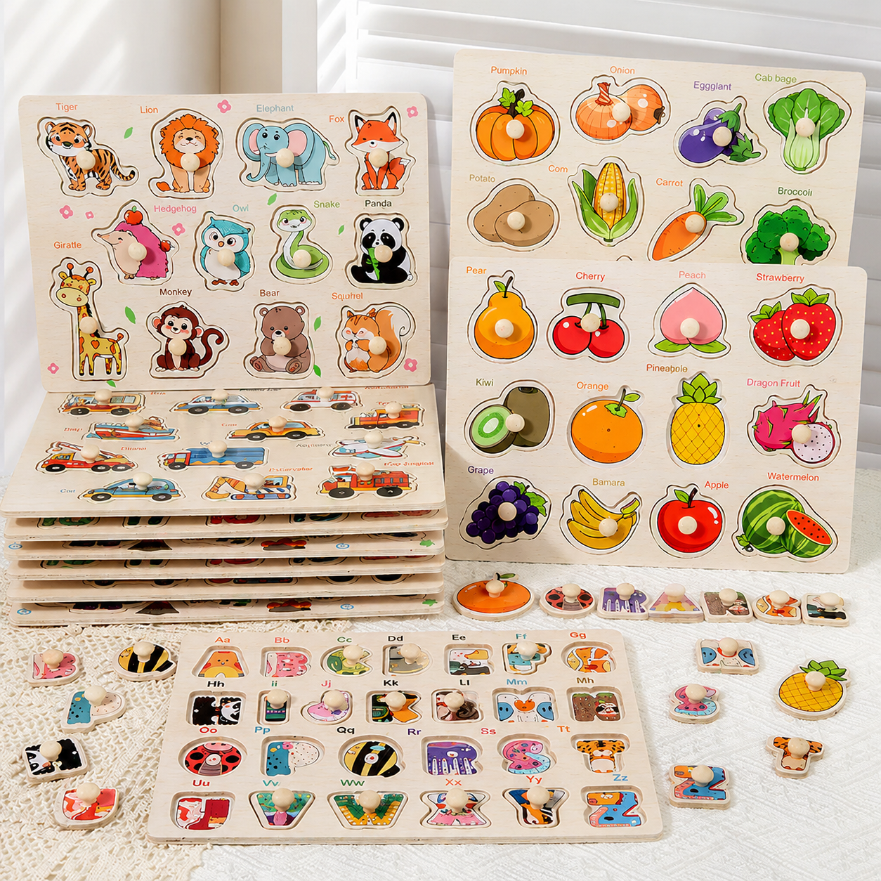 A colorful children's educational puzzle toy set featuring animal and fruit/vegetable cutout boards with labeled pieces, arranged on a white textured surface.