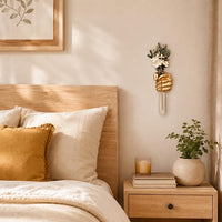 Wall-hanging vase presenting one flower in a compact vertical arrangement